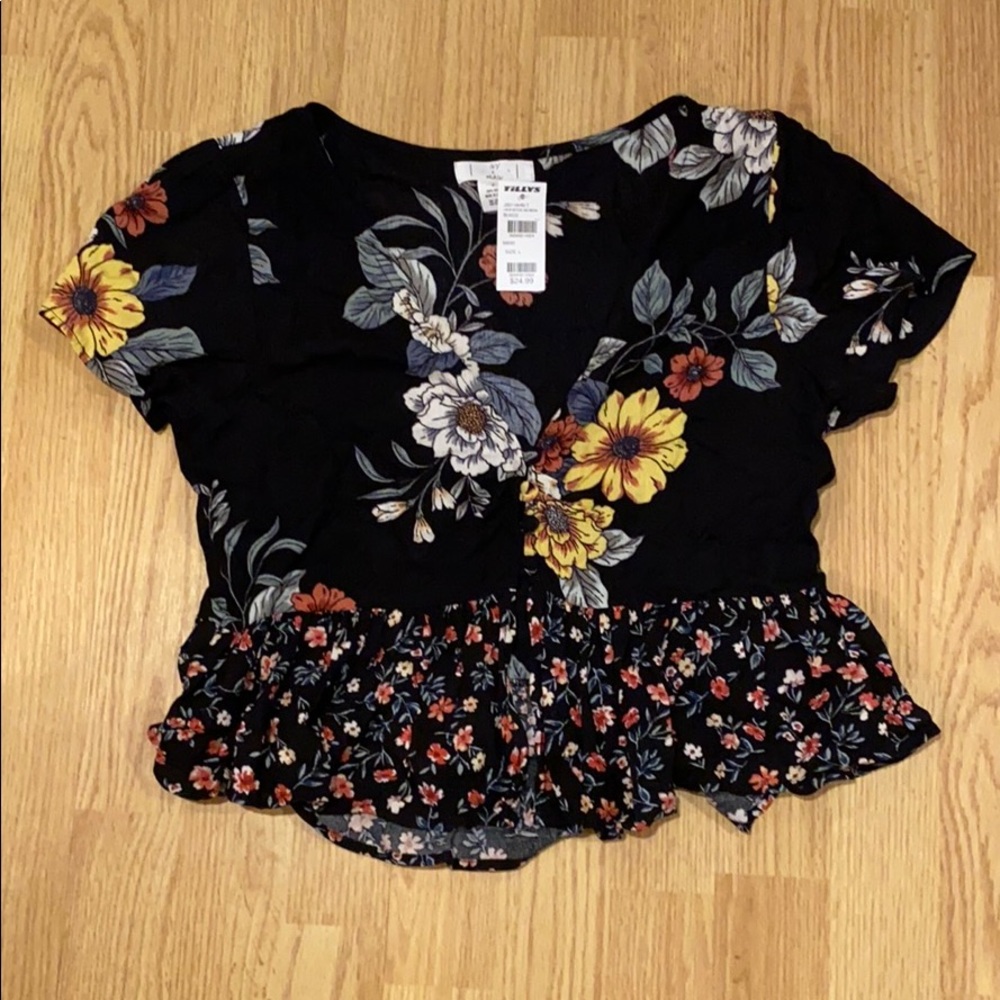 Blouse from Tillys that’s covered in flowers.